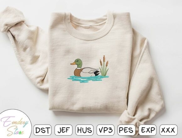 Etsy embroidery designs of a duck swimming near cattails on a beige sweatshirt
