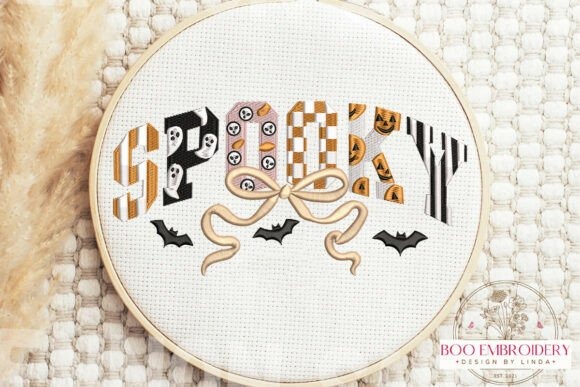 Etsy embroidery designs spelling SPooky with Halloween patterns and bats in an embroidery hoop